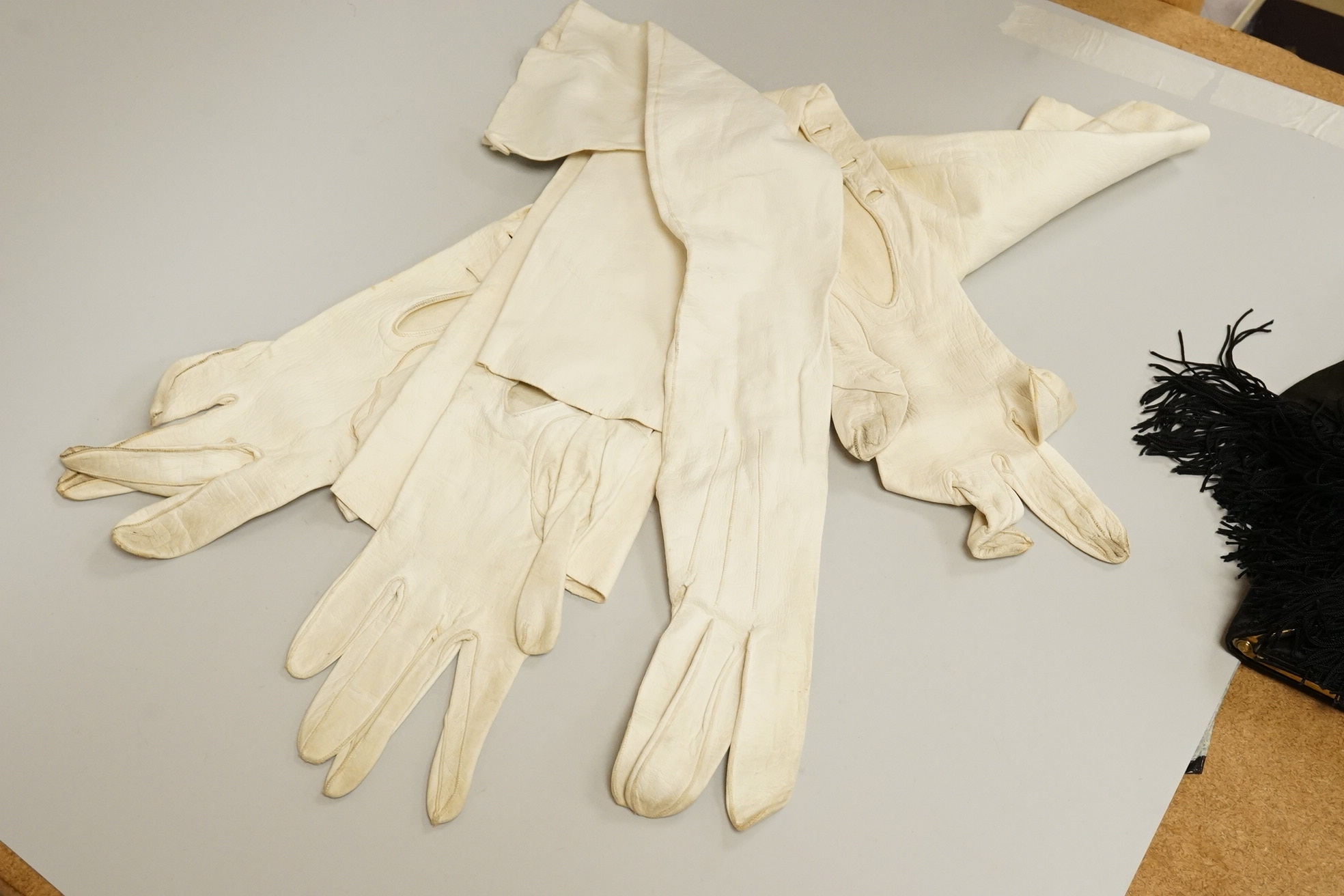 A cut steel fronter, a jet beaded panel, a pair of fringed black suede gauntlets, a seed pearl headdress, etc.